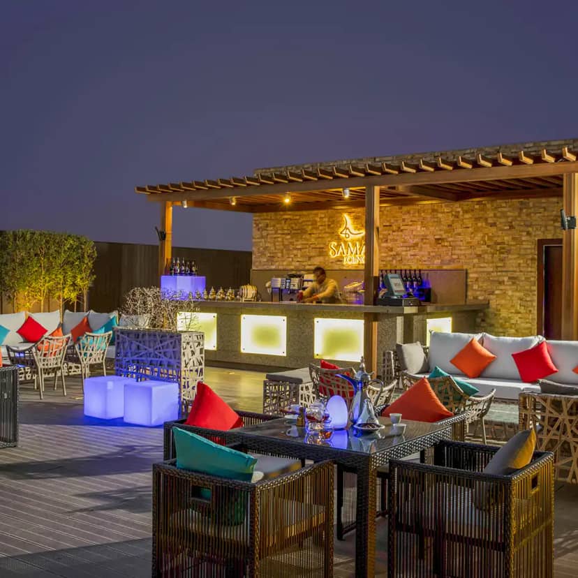 Sama Lounge Terrace: Upscale outdoor networking reception and corporate cocktail hour setup.