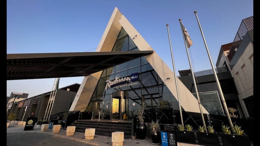 Modern entrance of Radisson Blu Riyadh Qurtuba event hall, professional conference venue.