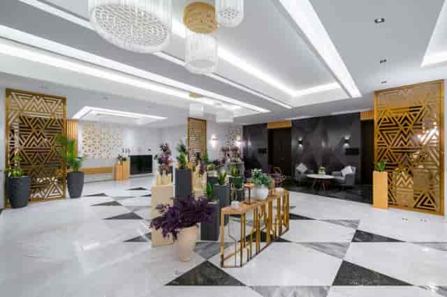 Modern Radisson Blu Riyadh foyer with gold partitions for corporate events and business conferences.