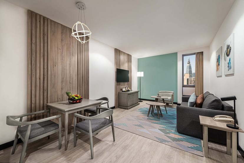 Modern hotel suite dining area for VIP meetings or luxury business events at Courtyard Riyadh Olaya.