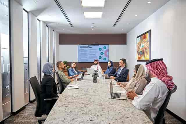 Executive boardroom in Roshn Business Front with AV system for corporate strategy meetings.