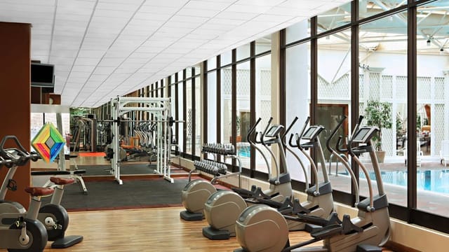 Sheraton Riyadh hotel fitness center with pool access for corporate wellness and business events.