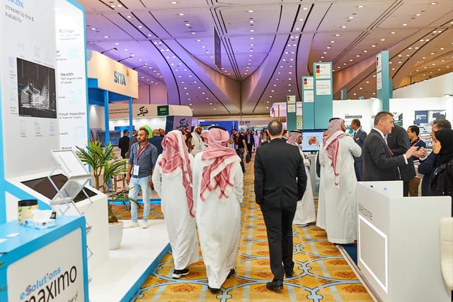 Webinar booth at Saudi Airport Exhibition, featuring professional trade show networking and branding.
