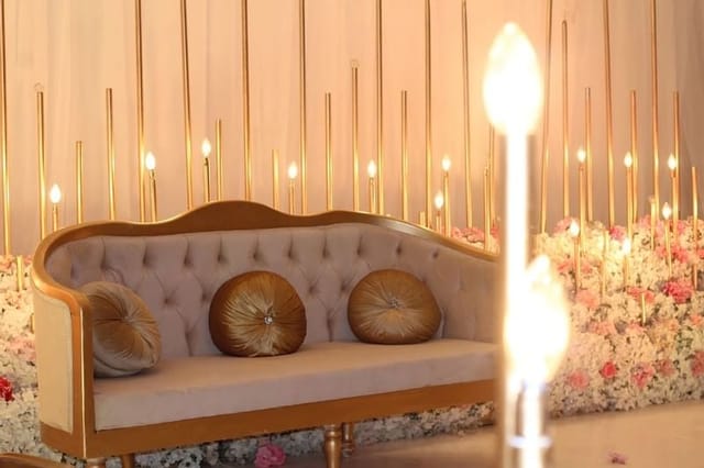 Luxury wedding sweetheart table with gold accents at Warwick Riyadh event lounge.