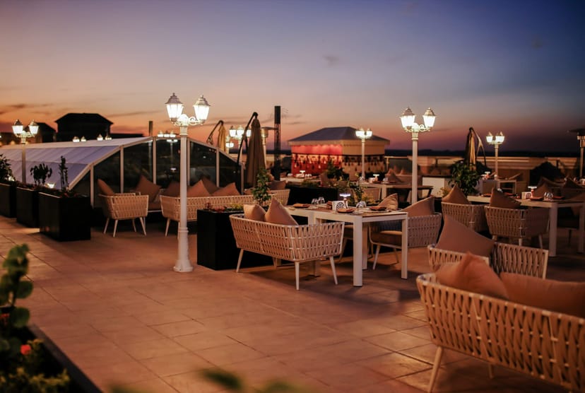 Rooftop lounge with ambient lighting for networking receptions and corporate cocktail events.