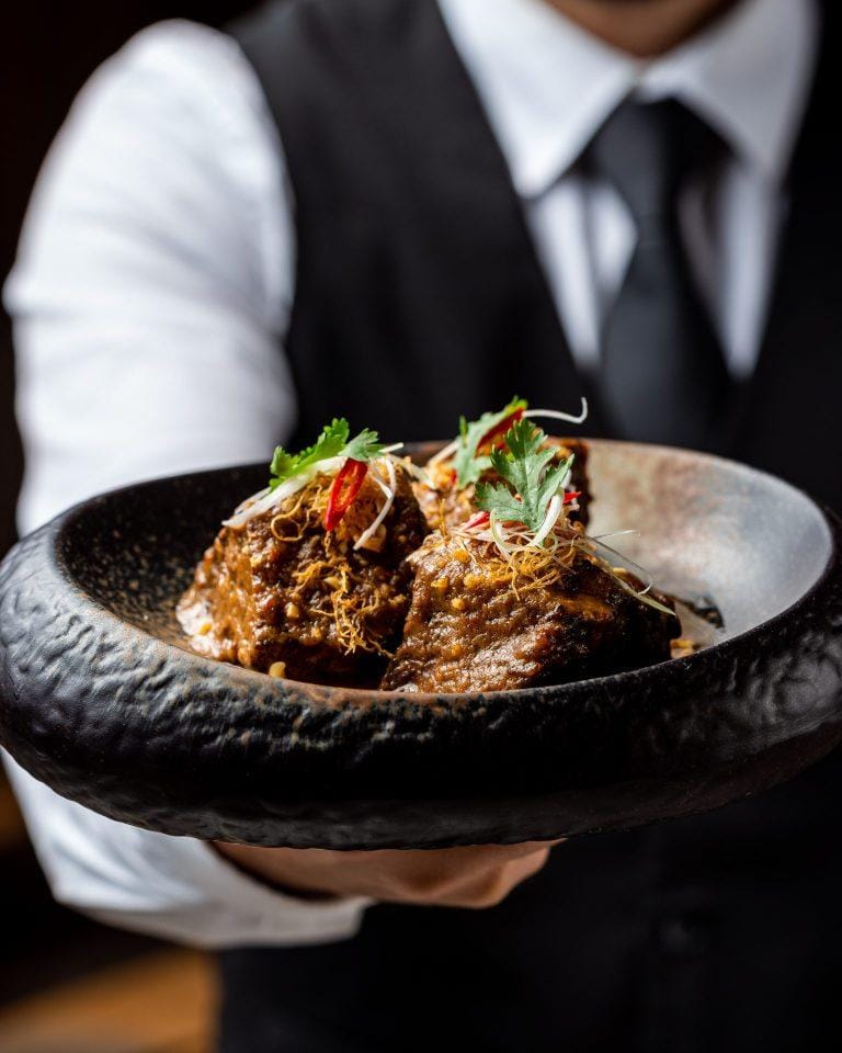 High-end Spago plated entrée for VIP gala dining and banquet service.