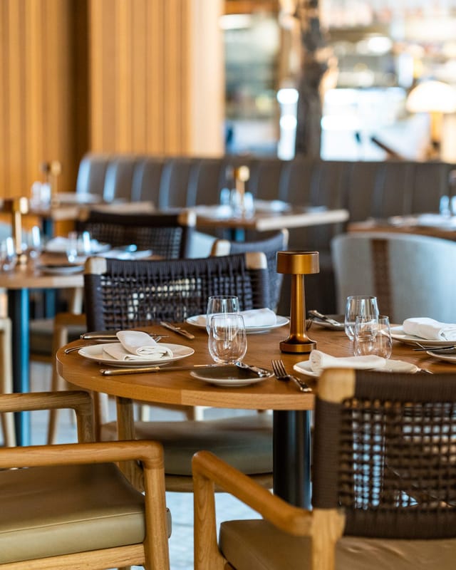 Spago restaurant interior with modern lighting, ideal for upscale networking and business events.