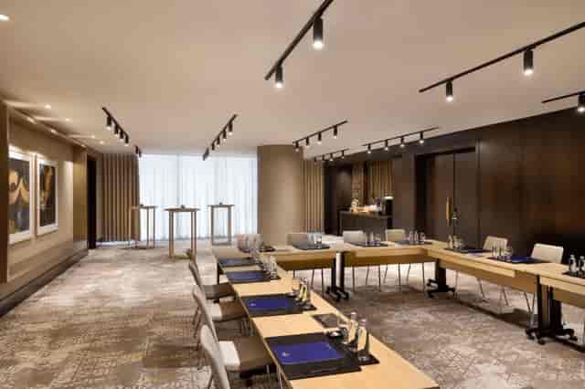 Modern U-shaped meeting room at Hilton Riyadh Olaya for board meetings and corporate workshops.