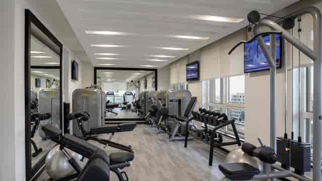 Modern fitness center at Centro Olaya for corporate wellness and incentive travel events.