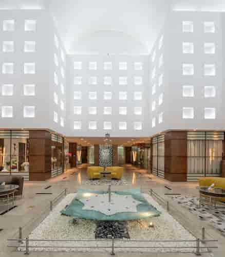 Modern Radisson Blu Riyadh meeting room with high ceilings for corporate events and networking.