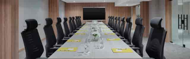 Executive boardroom at Crowne Plaza Riyadh Palace, featuring ergonomic seating for corporate meetings.