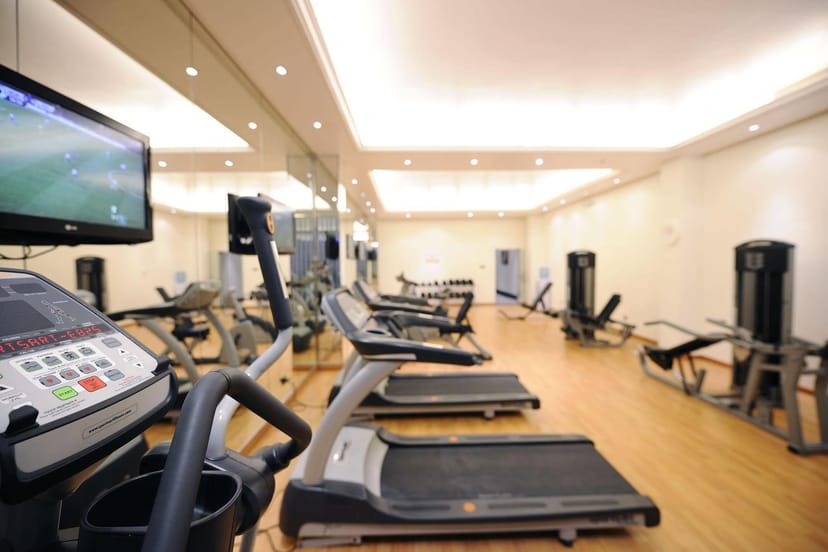 Fitness center at Qaser Al Hamra by Warwick for corporate retreat and conference wellness.