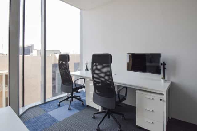 Minimalist private office with panoramic views, ideal for professional meetings and deep work.