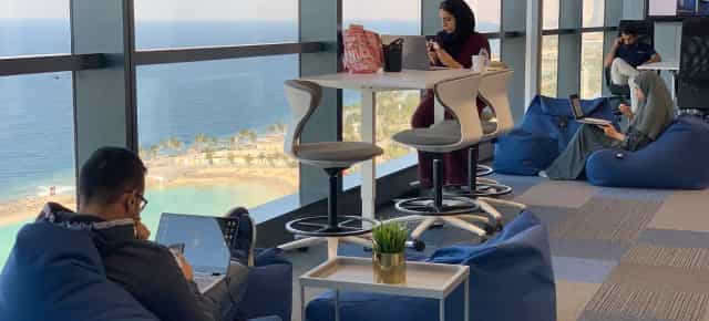 Modern private office with beanbag zones for flexible coworking and collaborative workspaces.