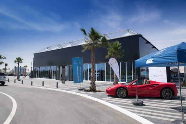 Corporate conference pop-up venue at RAK Expo with premium vehicle display and branding.