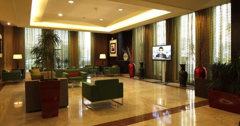 Class Offices pre-function lounge with ambient lighting for VIP hospitality and networking events.