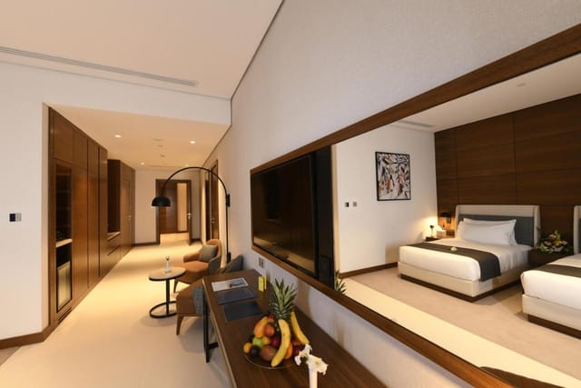 Luxury hotel suite with workspace for VIP conference delegates and business travel.