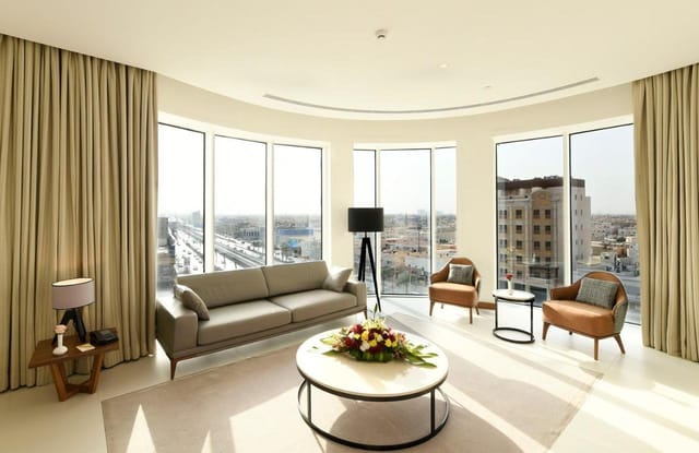 Executive suite at Hotel Golden Tulip Riyadh for professional board meetings and VIP interviews.