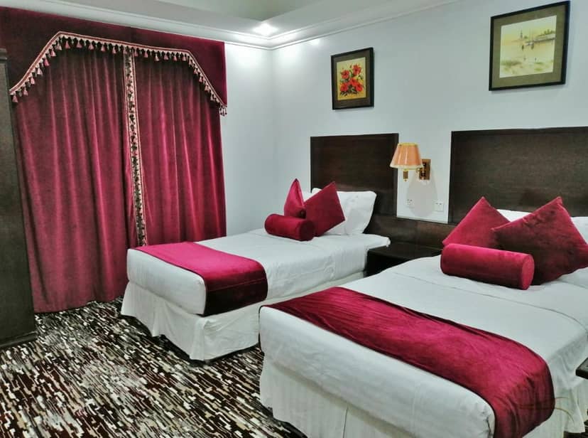 Carawan AlFahad Hotel twin room: dated hotel accommodation for budget corporate event bookings.