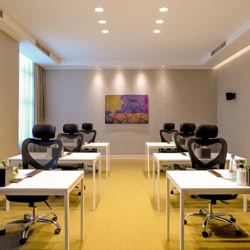 Classroom-style boardroom at Al Takhasussi Palace for professional workshops and training sessions.