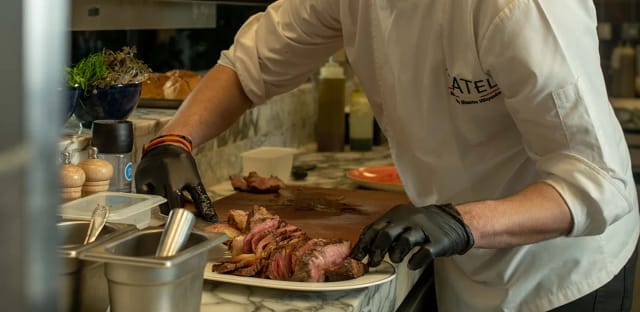 Chef carving station at TATEL Riyadh, upscale culinary experience for luxury event catering.