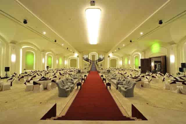 Madareem Hotel ballroom with red carpet aisle for luxury gala and formal event venue.
