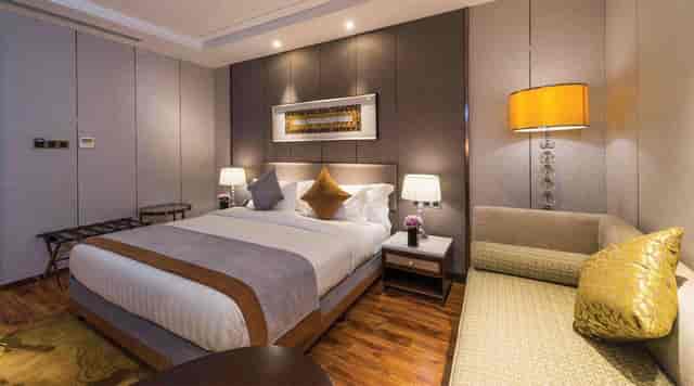 Luxury VIP hotel suite with lounge area, ideal for corporate event hosting and executive lodging.