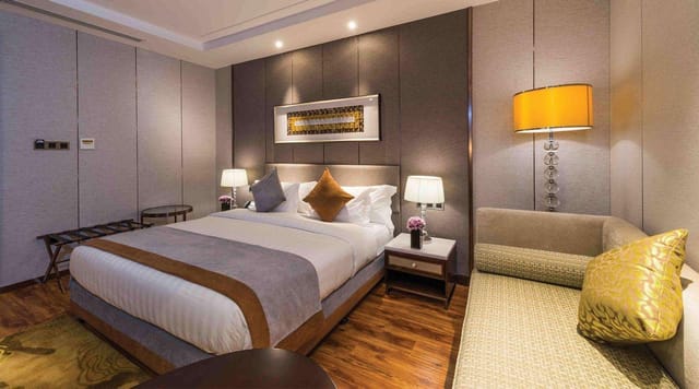 Luxury VIP hotel suite with lounge area, ideal for corporate event hosting and executive lodging.