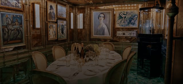 Elegant private dining room with wood paneling for VIP dinners and corporate board meetings.