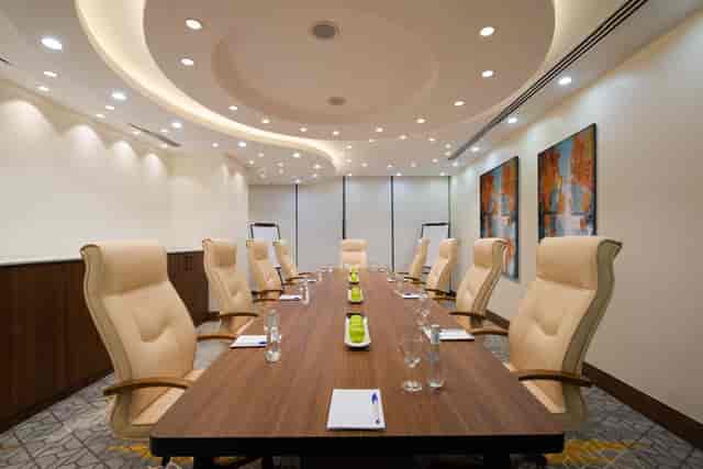 Luxury hotel boardroom with ergonomic seating for executive meetings and corporate strategy.