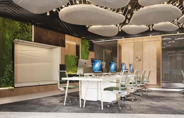 Modern biophilic private office with acoustic panels for corporate offsites and co-working hubs.
