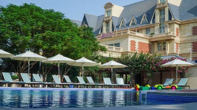Upscale poolside at Al Aziziyah Boutique Hotel, perfect for executive retreats and networking.