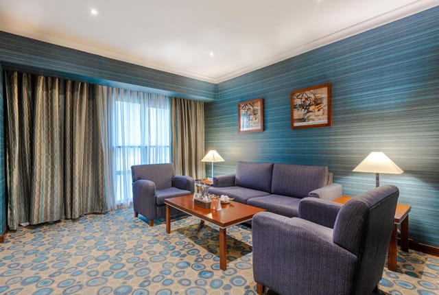 Professional meeting room in Al-Aqeeq Hotel for small breakout sessions and business consultations.