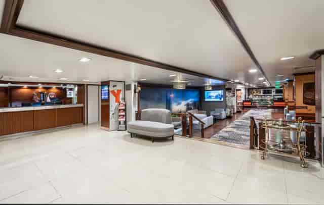 Golden Tulip Al Nasiriah hotel lobby featuring registration area and breakout networking space.