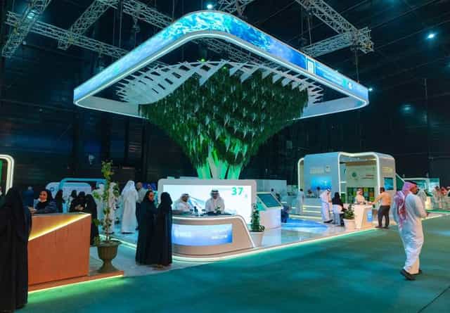 Trade show exhibition hall with biophilic overhead structure for corporate event and brand activation.