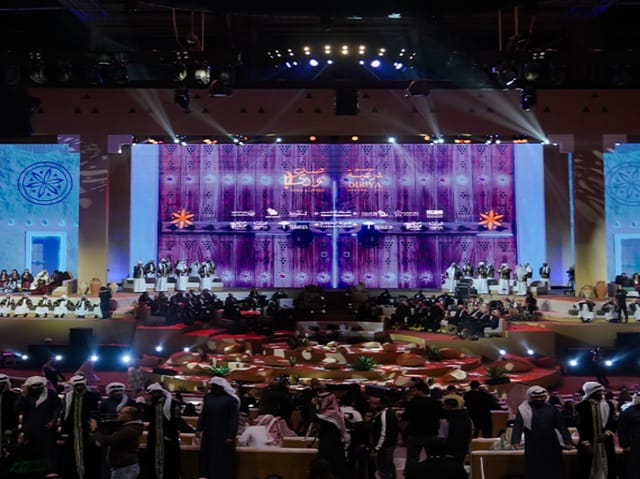 Diriyah Grand Hall stage with LED backdrop for corporate events and business conferences.