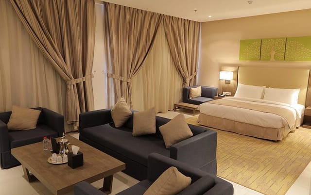 Spacious Tulip Inn Riyadh hotel suite with lounge area for VIP executive retreats.