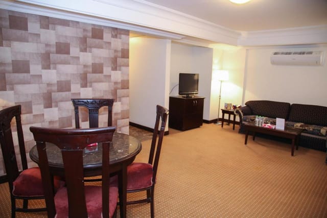 Tulip Inn Riyadh hotel suite, functional layout for business meetings and hospitality events.