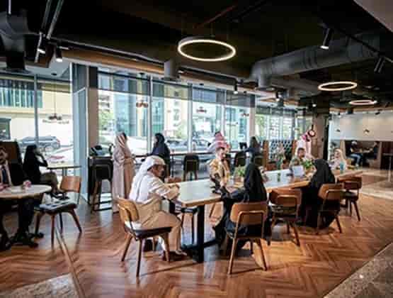 Modern coworking space with natural light for professional networking and business meetings.