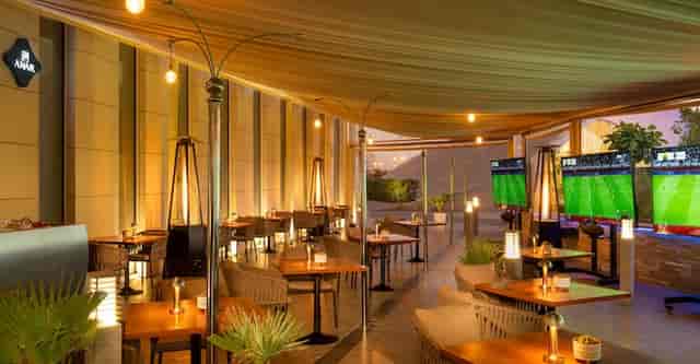Stylish outdoor cafe at Hilton Riyadh, ideal for corporate events and gatherings.