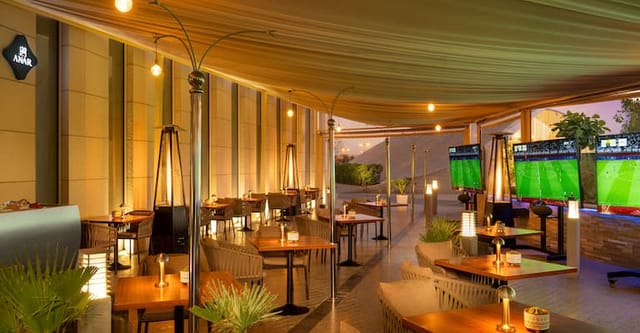 Stylish outdoor cafe at Hilton Riyadh, ideal for corporate events and gatherings.