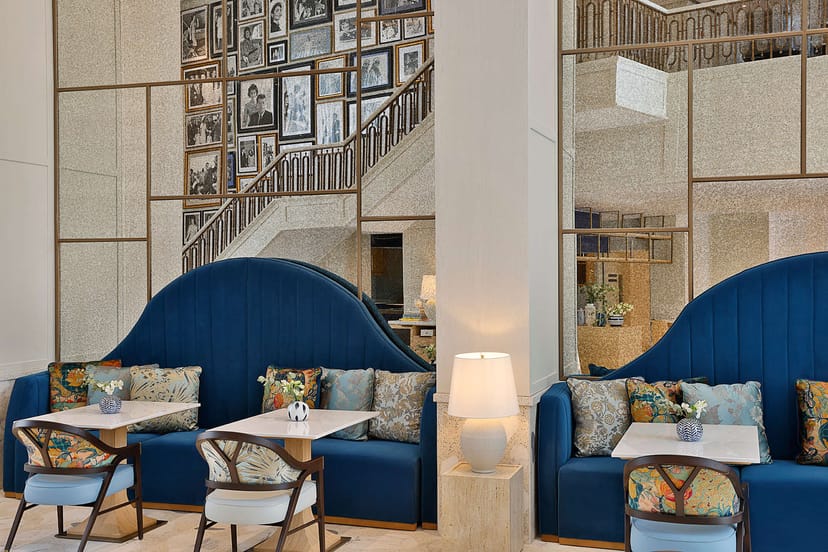 Stylish lounge at Jackie Restaurant, blue seating, perfect for networking events.