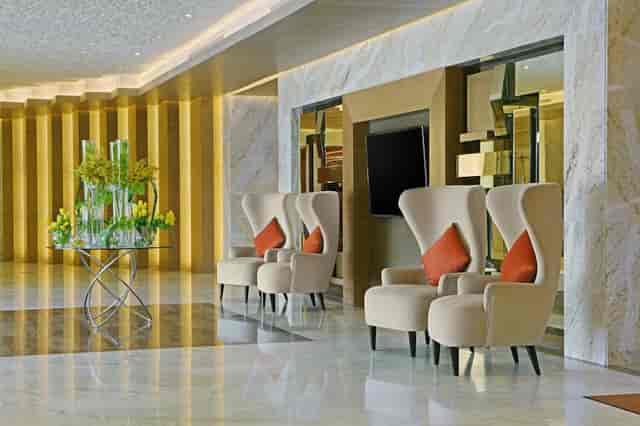 Sophisticated event space in DoubleTree Riyadh with stylish armchairs for networking.