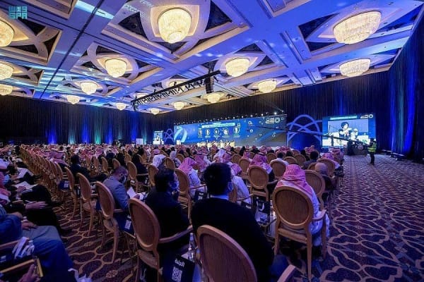 Gheeras World ballroom with stage and theater seating for corporate conferences and summits.