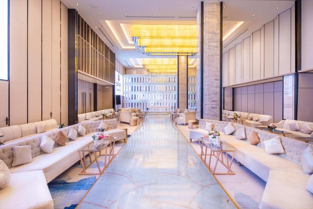 Luxury hotel pre-function area with linear seating for upscale events and brand activations.