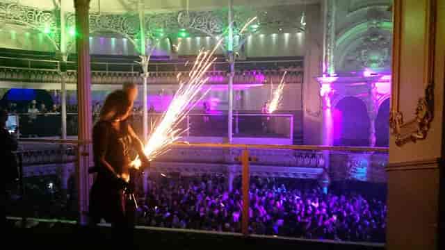 Vibrant O2 Academy Bournemouth event with performer and sparklers, perfect for celebrations.