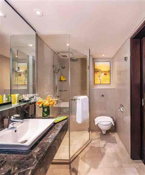 Luxury hotel bathroom at Balmoral Hall, Royal Plaza on Scotts for VIP event accommodations.