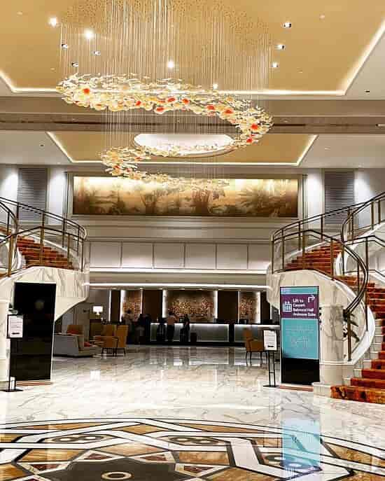 Ardmore Suite lobby with grand twin staircases, perfect for VIP check-in and event registration.