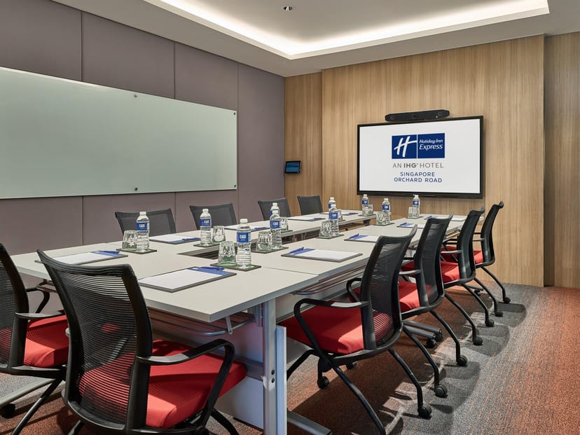 Modern boardroom at Holiday Inn Singapore Orchard City Centre for business meetings and conferences.