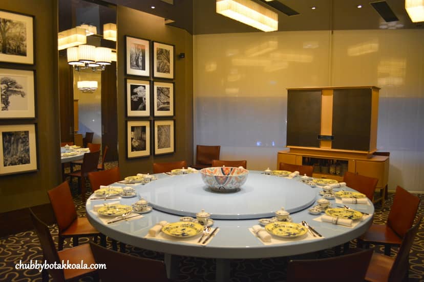 Private dining room at Elm Summer Pavilion with circular table for upscale banquet events.